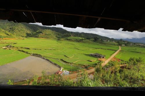 an aerial view of a golf course with a river at Mu Cang Chai Eco Lodge in Nam San