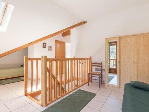 a living room with a staircase and a bedroom at Appartement Saint-Chaffrey , 3 pièces, 6 personnes - FR-1-330E-21 in Saint-Chaffrey