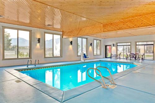 a large swimming pool in a house with a ceiling at Super 8 by Wyndham S Jordan/Sandy/Slc Area in South Jordan