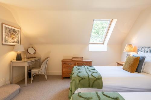 En eller flere senge i et værelse på Rambling Rose