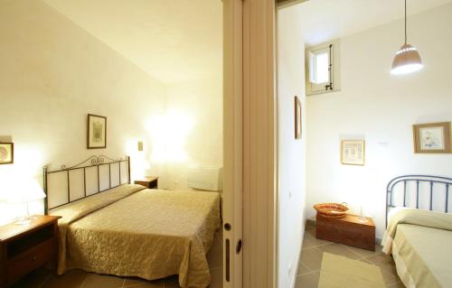 Ένα ή περισσότερα κρεβάτια σε δωμάτιο στο Residence Erice Pietre Antiche