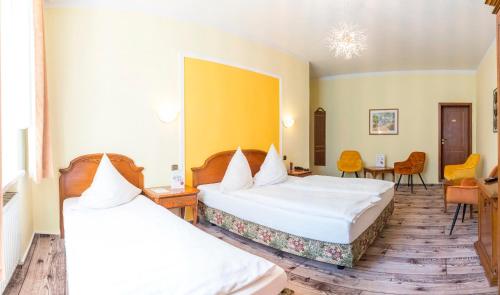 Postel nebo postele na pokoji v ubytování Hotel Alexandra
