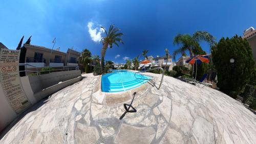 a swimming pool on top of a resort at MAYA in Paphos City