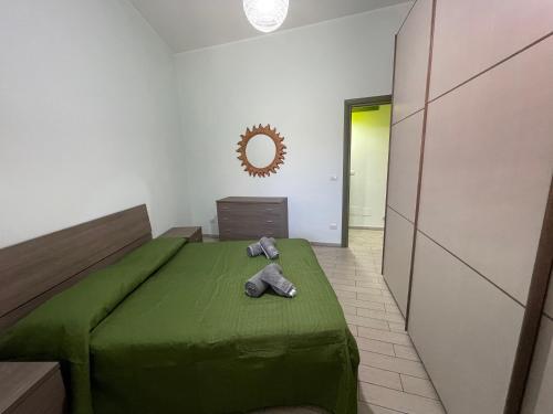 Postel nebo postele na pokoji v ubytování Enza’s home Taormina