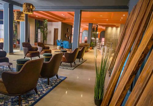 a lobby with chairs and a waiting room at HOTEL MASSALEY in Bamako