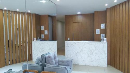 Uma área de estar em Hotel Elo Curitiba