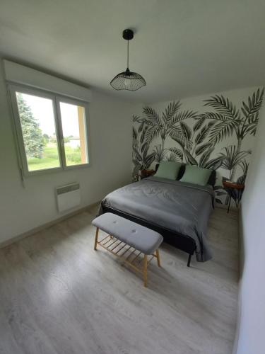 a bedroom with a large bed and a window at Appt spacieux et lumineux pour 6 pers in Giffaumont