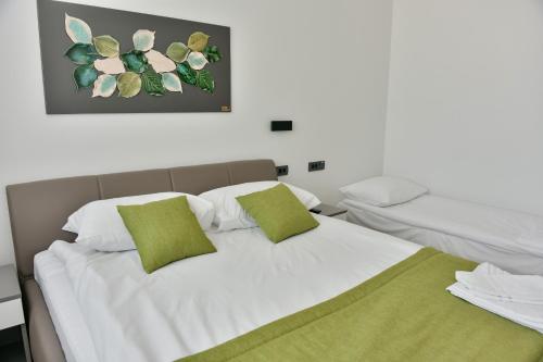 Ένα ή περισσότερα κρεβάτια σε δωμάτιο στο HOSTEL GREEN