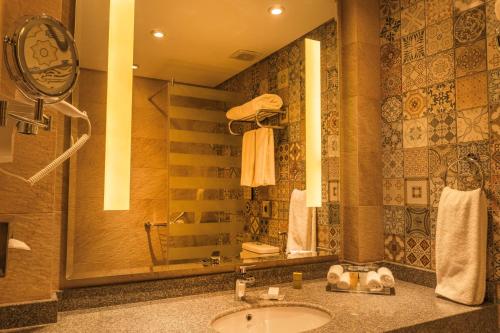 a bathroom with a sink and a mirror at Safir Dahab Resort in Dahab