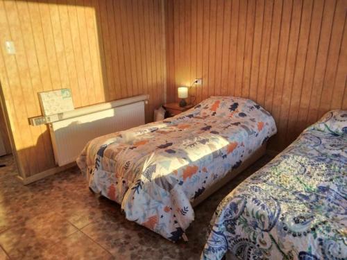 a room with two beds in a room at Cabañas 644 in Porvenir
