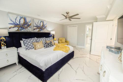 a bedroom with a bed and a ceiling fan at Newly Listed! 20 Percent Off! Golf and Tennis Community - Lavish Living in Wesley Chapel