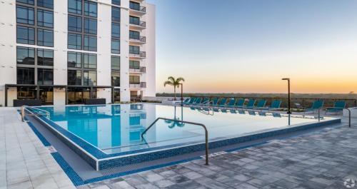 a swimming pool on the roof of a building at Business District Apartments by Barsala in Orlando