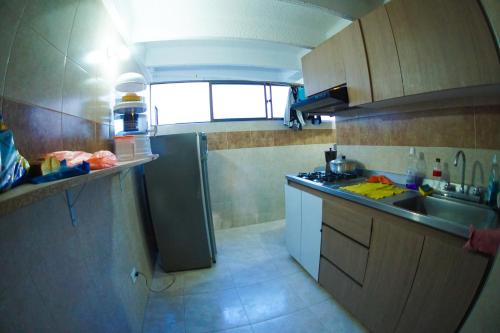 Cuisine ou kitchenette dans l'établissement Habitación privada con baño privado.