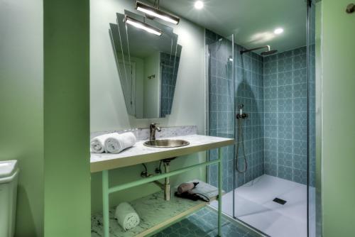 a bathroom with a sink and a shower at Grand Paradiso Ibiza - Adults Only in San Antonio Bay