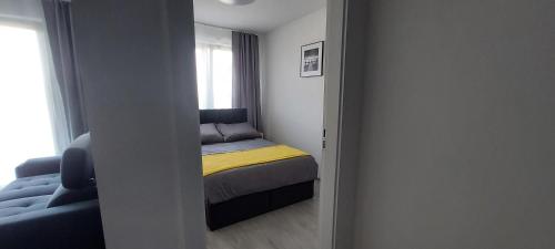 Posteľ alebo postele v izbe v ubytovaní Apartament BARCELONA
