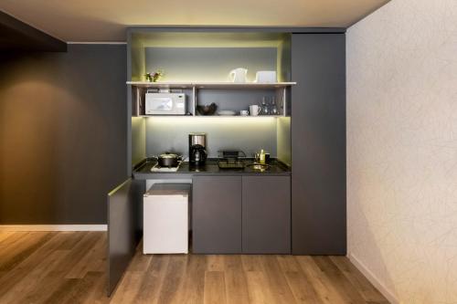 a small kitchen with a counter and a shelf at Top Rentals Montañeses in Buenos Aires