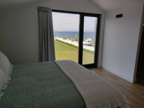 Postel nebo postele na pokoji v ubytování POLAS BEACH LOFT