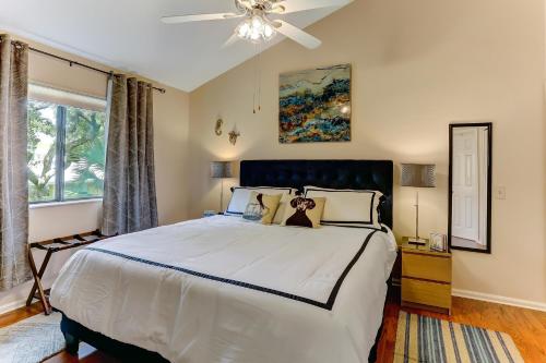 a bedroom with a large bed and a window at Walk to Beach-Forest Ridge 2747-Pool,Tennis,Pickleball,Playground-Nestled Amongst the Oaks in Fernandina Beach