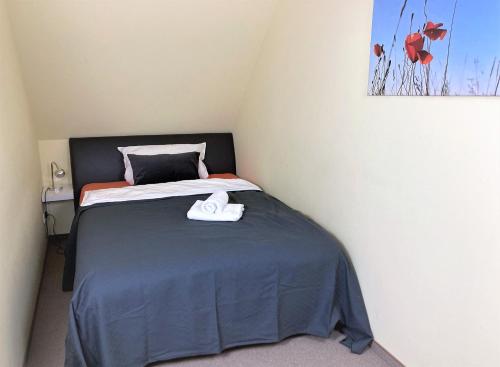 Postel nebo postele na pokoji v ubytování Haus Hotel & Pension am Birnengarten