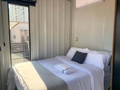 Una cama o camas en una habitación de Charmoso Studio Moema