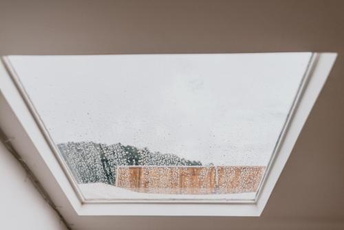 a skylight window with snow on it at Phu Morinn Cafe &Camping Monjam in Mon Jam
