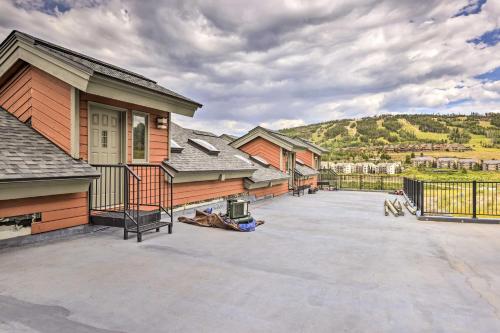 a house with a large driveway in front of it at Mtn View Granby Condo with In-Unit Hot Tub! in Granby