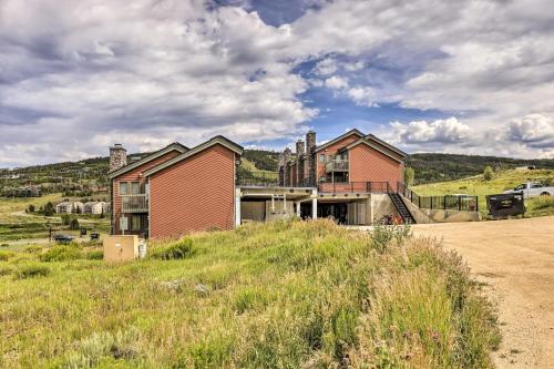 a house sitting on top of a dirt road at Mtn View Granby Condo with In-Unit Hot Tub! in Granby