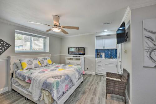 a bedroom with a bed and a ceiling fan at Cute Central Placerville Studio Pet Friendly in Placerville