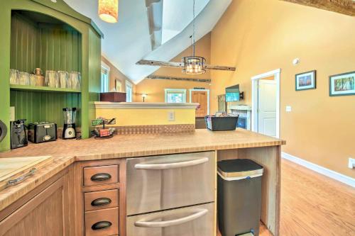 a kitchen with a counter with a sink and a stove at Hidden Gem Cottage Near Blue Hill Peninsula in Brooklin