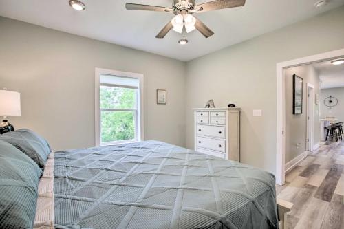a bedroom with a bed and a ceiling fan at Modern Waveland Home with Deck, Walk to Beach! in Waveland