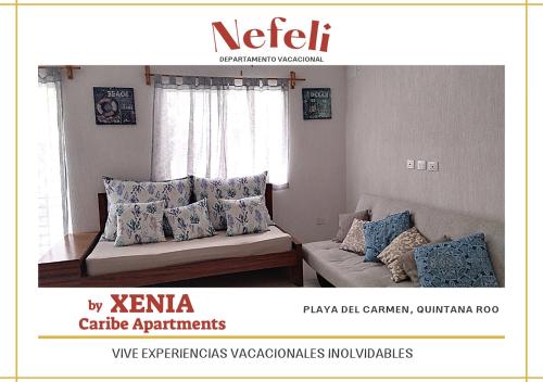 una imagen de una sala de estar con sofá y almohadas en NEFELI departamento by Xenia Caribe en Playa del Carmen