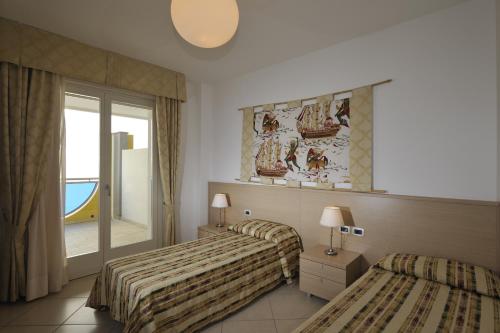 Posteľ alebo postele v izbe v ubytovaní Ashanti Aparthotel Wellness&Spa