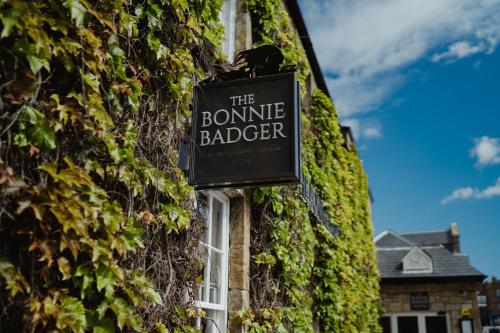 a sign on the side of a building at The Bonnie Badger in Gullane