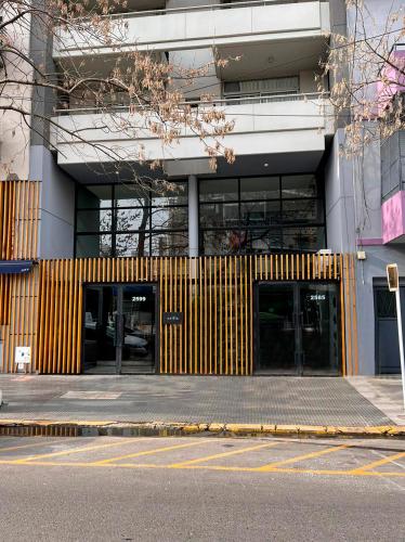 a building with two entrances to a building with glass doors at Top Rentals Montañeses in Buenos Aires