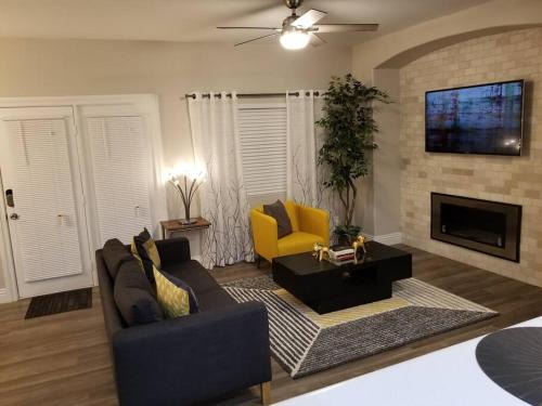 a living room with two couches and a fireplace at A - Fully remodeled and professionally decorated in Las Vegas