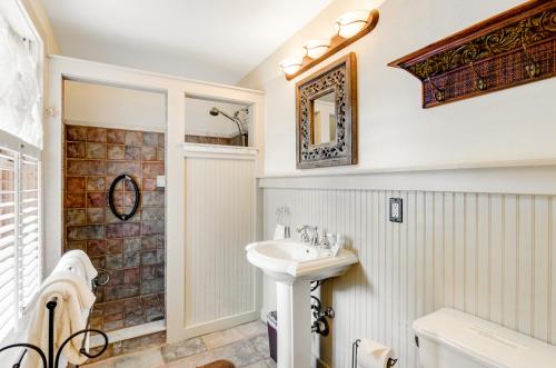 a bathroom with a sink and a shower at Taylor Cottage in Savannah