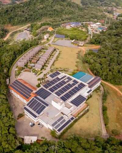 an aerial view of a building with solar panels at Resort Ecoar in Gaspar