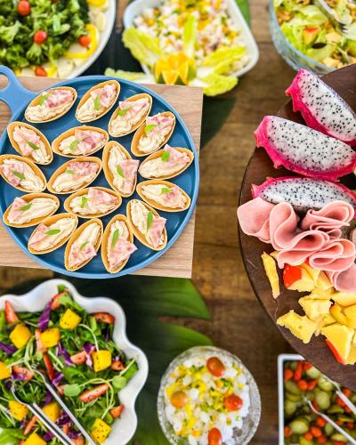 a bunch of plates of food on a table at Resort Ecoar in Gaspar