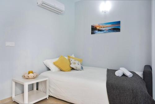 Posteľ alebo postele v izbe v ubytovaní MALAGUETA BEACH HOUSE