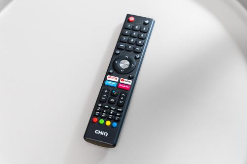 a remote control sitting on top of a table at Penzion Expo Dream #33 by Goodnite cz in Brno