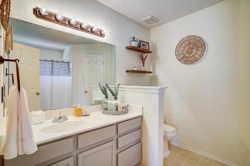 a bathroom with a sink and a mirror at Brickhouse Retreat in Round Rock