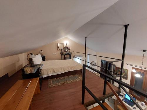 a bedroom with a bed in a attic at Villas El Paradiso in Kouroúpi