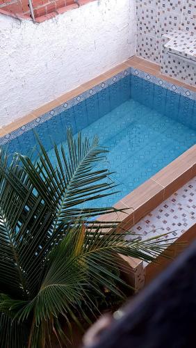 Der Swimmingpool an oder in der Nähe von Chalés Residência Tatiane