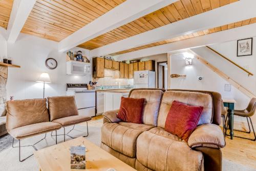 a living room with a couch and a table at Edelweiss Retreat in Government Camp