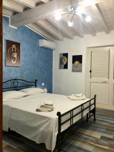 a bedroom with a large bed in a room at Villa Oasi Dei Sogni in Lampedusa