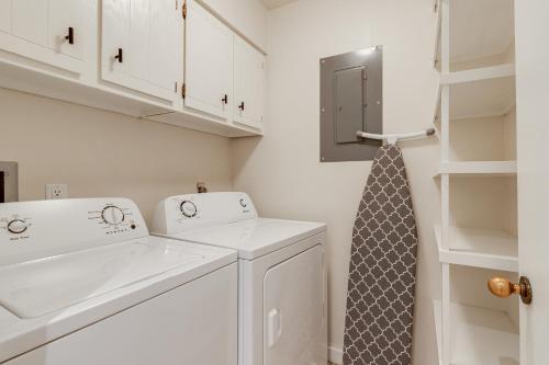a white laundry room with a washing machine and a tie at Teewinot C2 in Teton Village