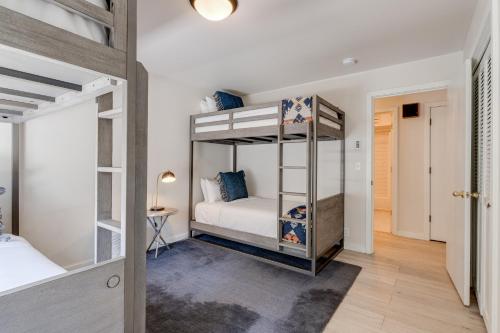 a bedroom with two bunk beds and a hallway at Teewinot C2 in Teton Village