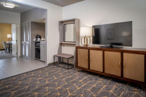 a kitchen with a television and a refrigerator at Holiday Inn Hotel & Suites Beckley, an IHG Hotel in Beckley