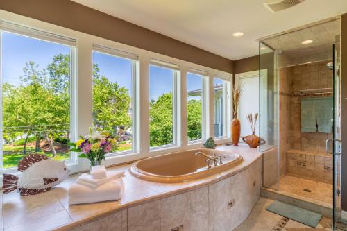 a large bathroom with a tub and a shower at The Admiral's Retreat in Annapolis
