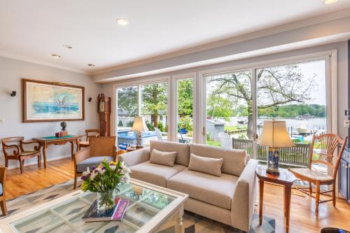 a living room with a couch and a table at Base Camp on the Lake in Annapolis